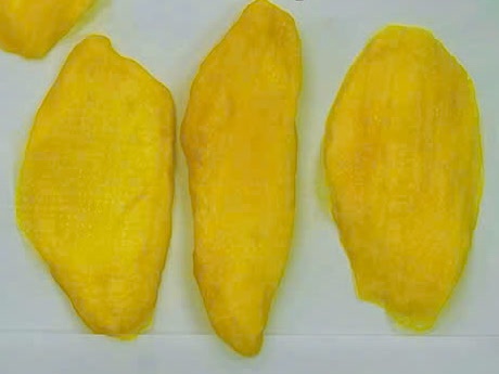 Three slices of soft dried mango